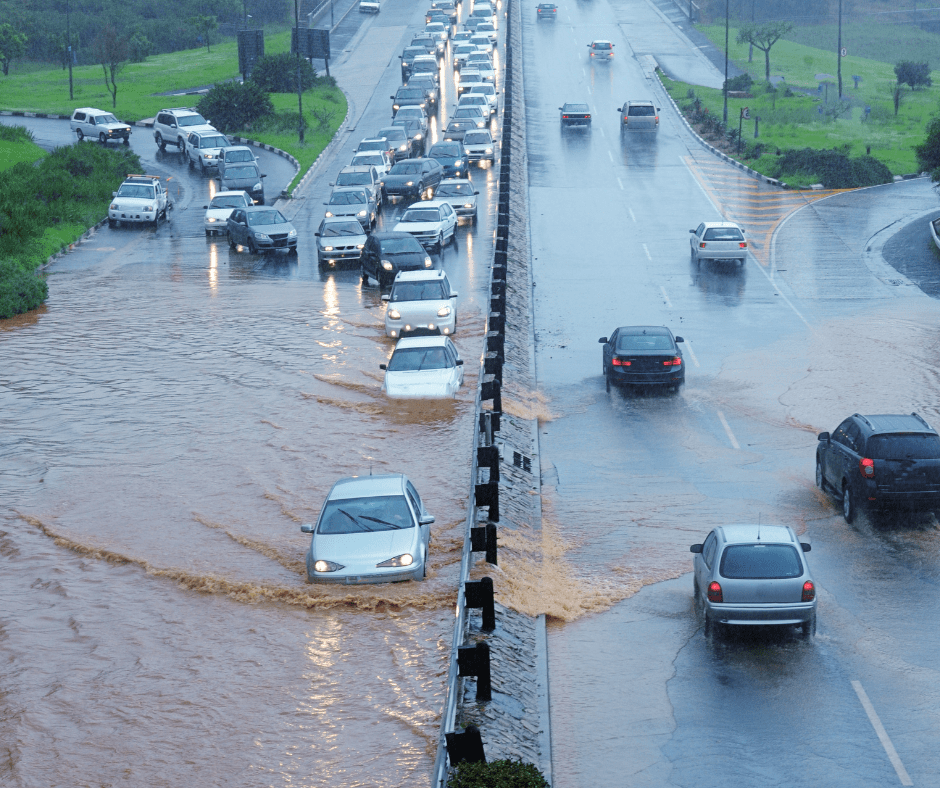 Cars driving on a flooded road getting stuck